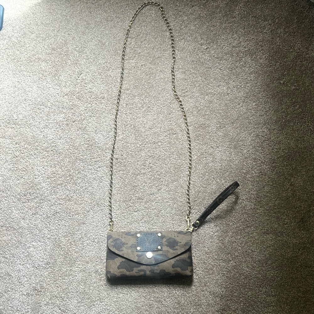 Unique clutch with repurposed LV embellishments